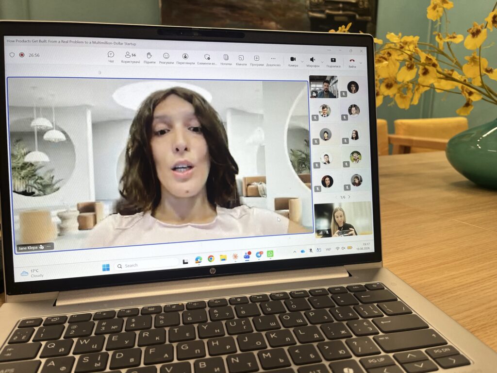 Jane Klepa of SET University moderating a video call shown on a laptop screen